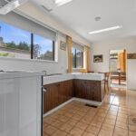 Kitchen at 34 Astelot Drive Doncaster East VIC featuring large windows, natural light and family layout