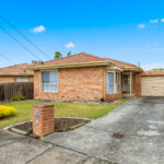 Front view house for rent 25 McKeon Circuit Dandenong North VIC with driveway and garage