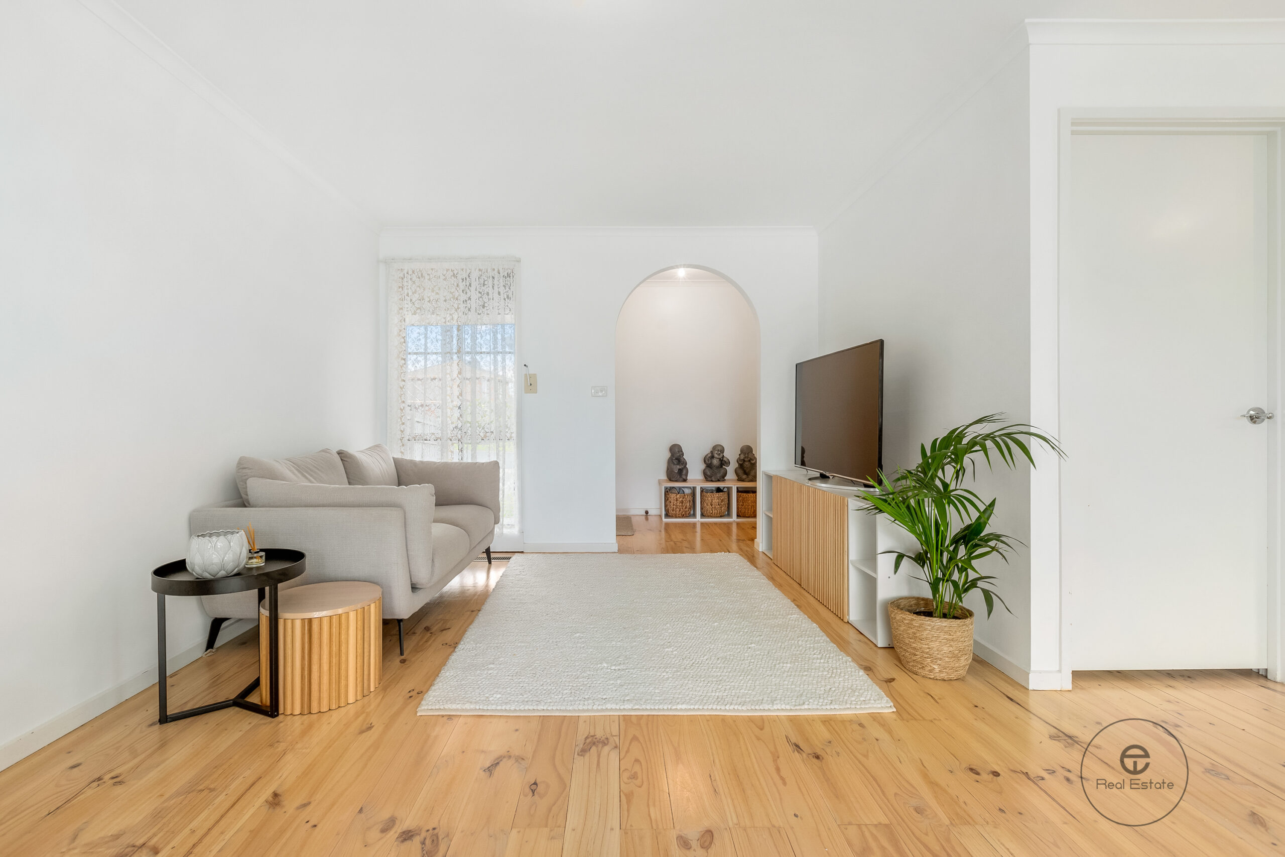 Open plan living and kitchen area at 25 McKeon Circuit Dandenong North VIC with timber floors