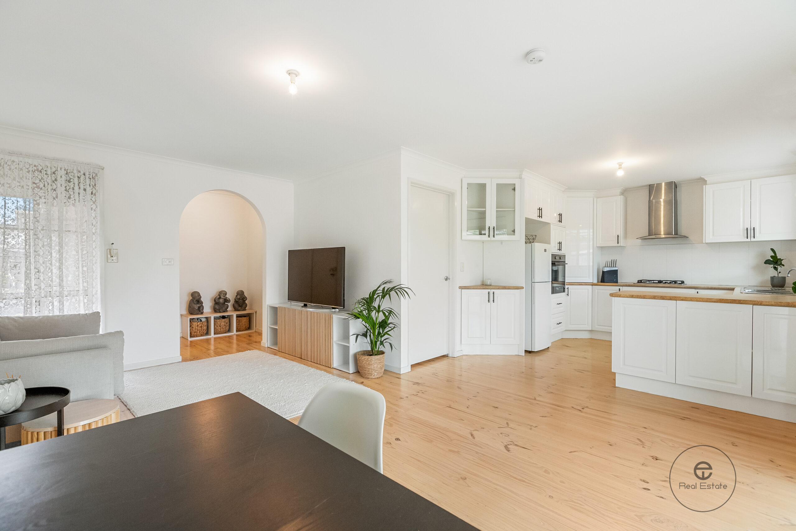 Modern white kitchen with gas cooktop at 25 McKeon Circuit Dandenong North VIC