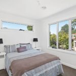 Well-designed laundry area at 8B Haros Avenue, Nunawading, offering practical workspace, storage cabinetry and convenient layout for everyday household tasks. This functional space complements the modern design of this townhouse for rent in Nunawading, Melbourne, providing comfort and practicality for tenants.