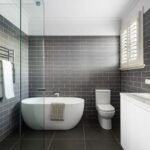 Modern renovated bathroom with freestanding bath and subway tiles – Camberwell family home 15 Lodge Road
