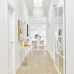 Bright hallway entrance at 9 Manton Street Melbourne featuring high ceilings, timber floors and modern interior design