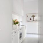 Modern laundry with built-in cabinetry at 9 Manton Street Richmond Melbourne